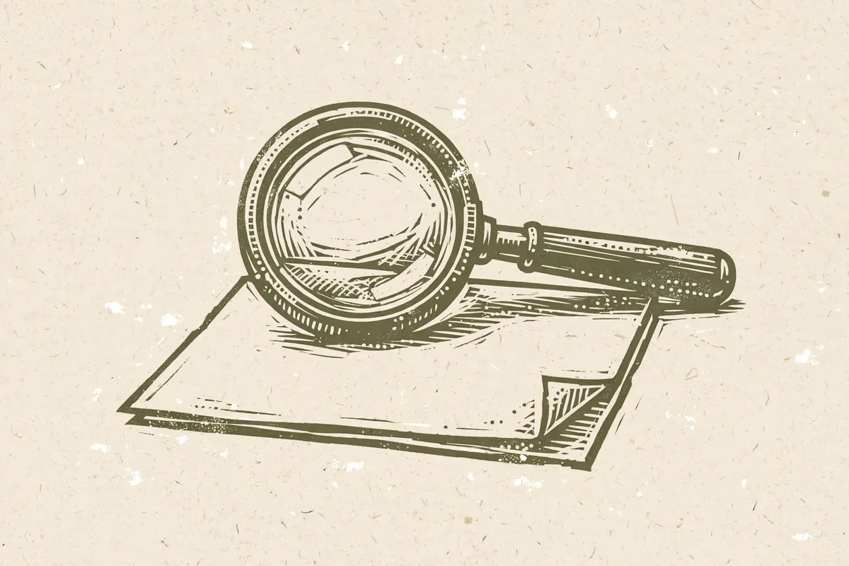 Woodcut-style illustration: a magnifying glass over a blank sheet of paper